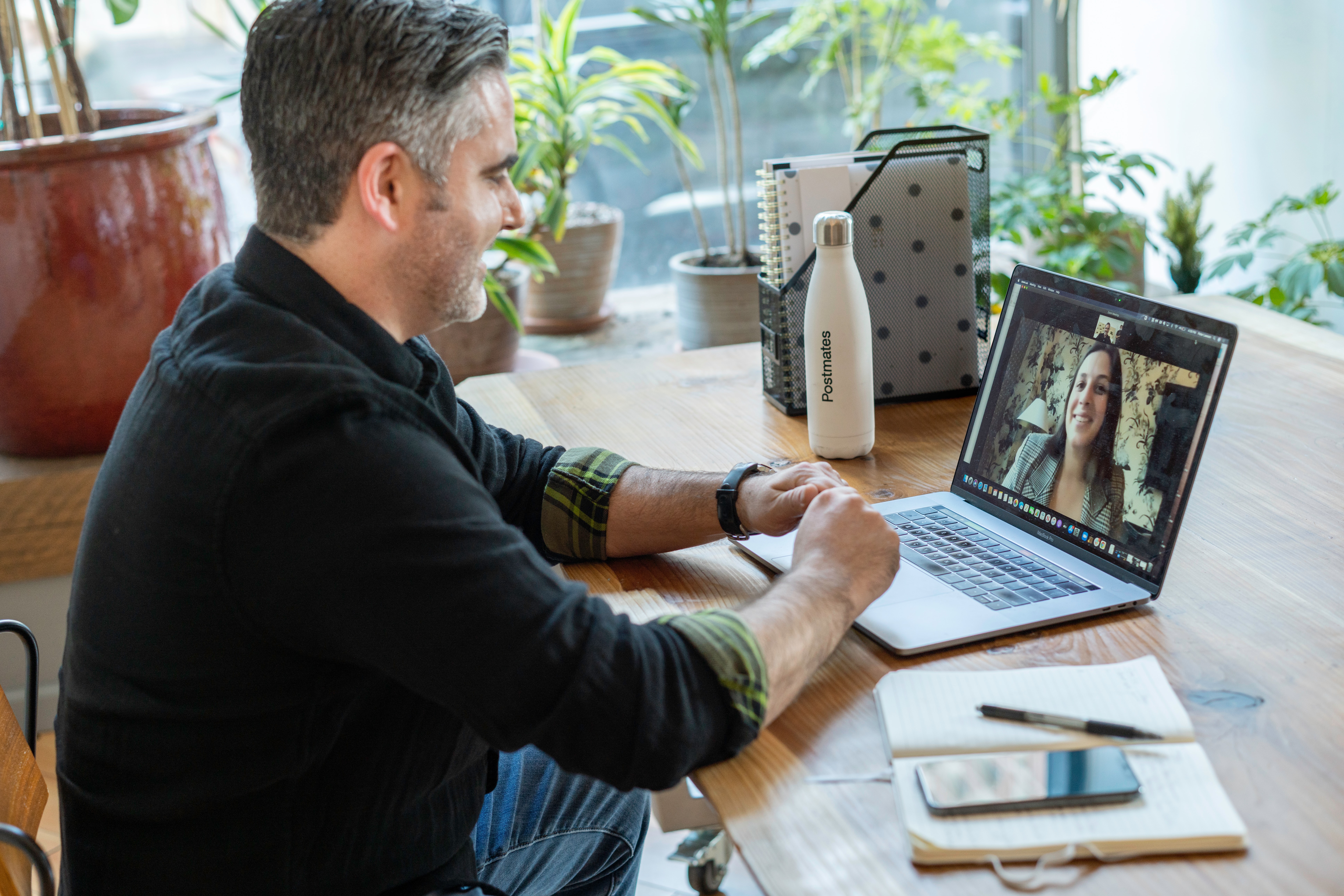 a-man-at-a-video-call-his-laptop-with-4-people